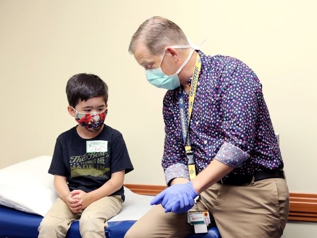 Urology patient Gabriel King with Dr. John Pope